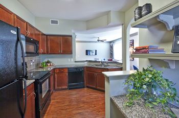 Plank wood flooring in kitchen and entry